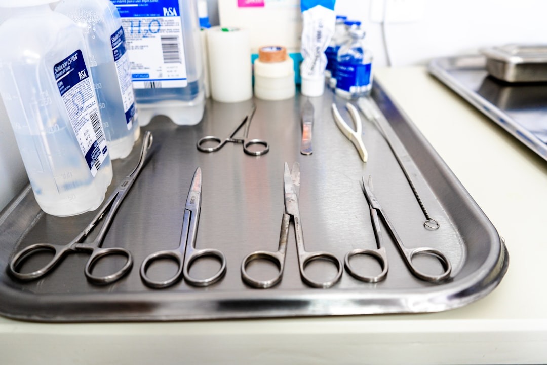 Shiny silver surgical instruments laid out on a tray.